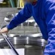 Checking the dimensions of the machined components after completion